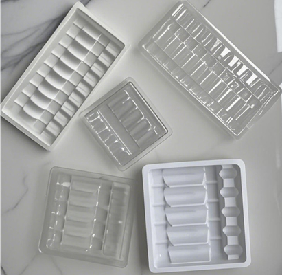 White PET Drug Plastic Blister Inside Anti-counterfeiting Design Pattern Ampoule Blister Tray Packing And Storage